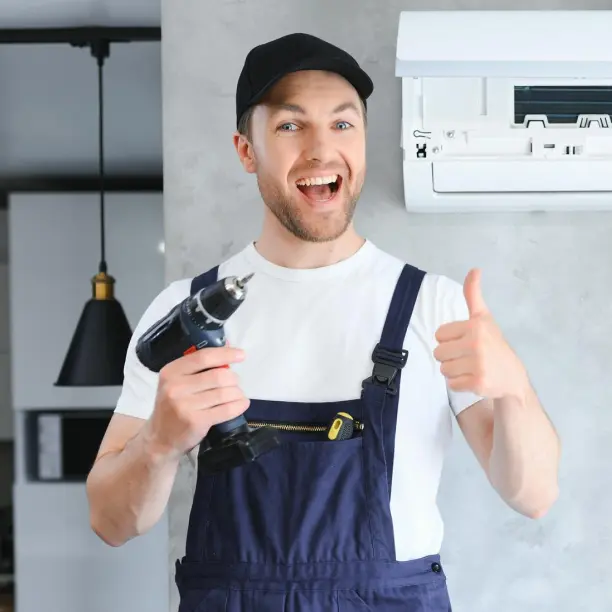 Commercial HVAC technician inspecting rooftop unit